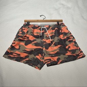 Orange, green and dark gray camouflage design.